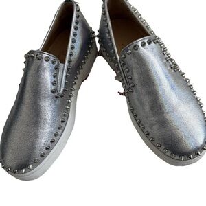 Christian Louboutin metallic Flat silver slip on with spikes Sneakers.